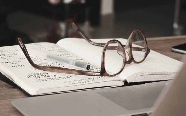 Pair of glasses on a notebook