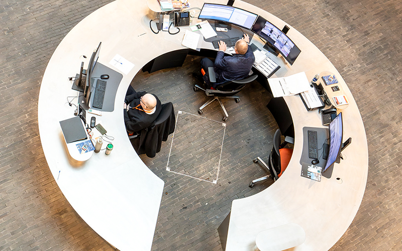 People working at a circular desk