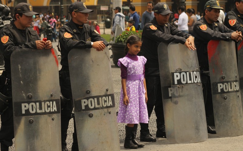 Little girl with riot police