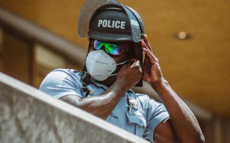 Police with face mask