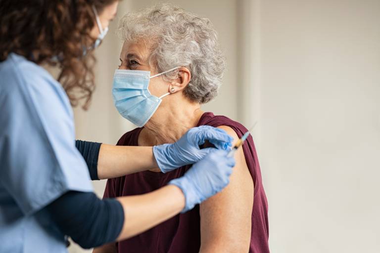 Old woman receive vaccine