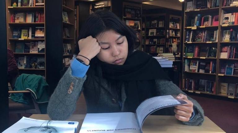 Aimi UCL Foundation (UPC) student studying in the library