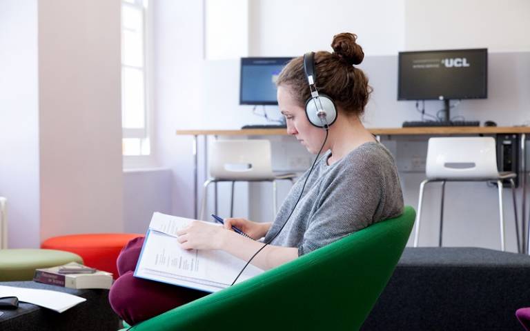 A student learning a language with headphones