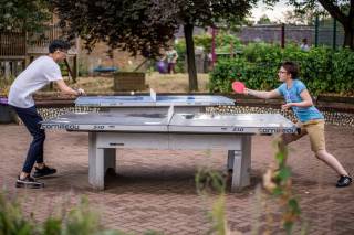 Juliette playing table tennis with another student on the Pre-University Summer School