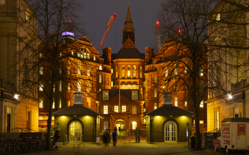 Front of the UCL Cruciform building at night time