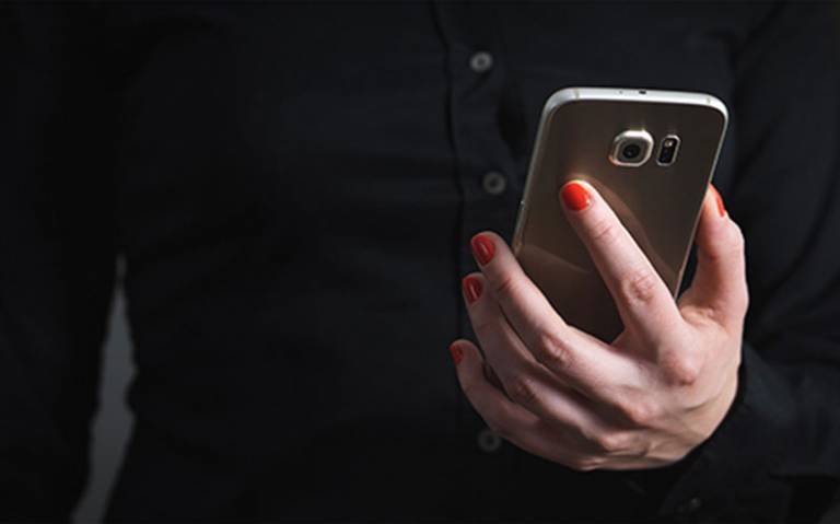 Image of person holding a mobile phone