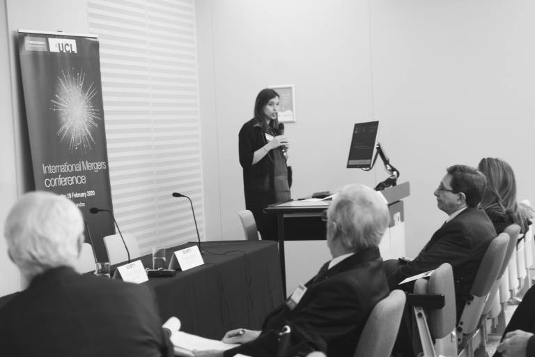 Image of Dr Mantzari speaking at international mergers conference