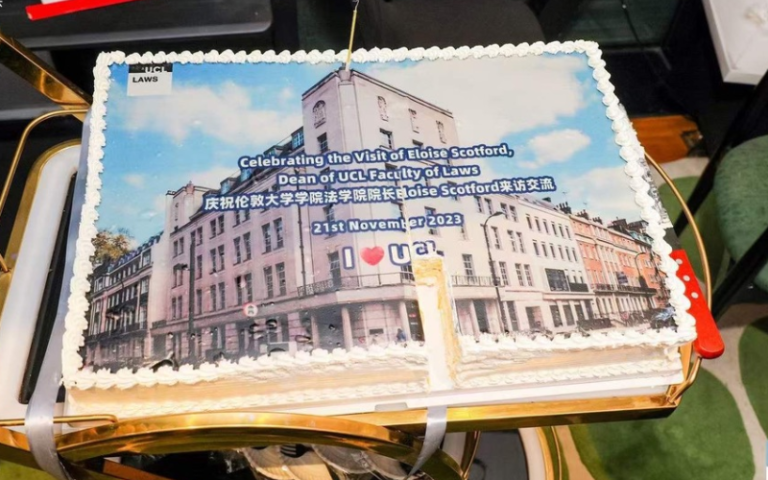 A cake with a photo of Bentham House printed on it.