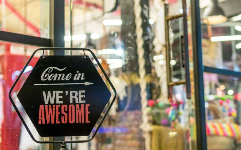 Image of shop with sign saying Come in - we are awesome