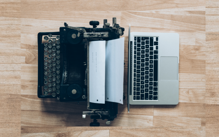 Image of a typewriter and laptop