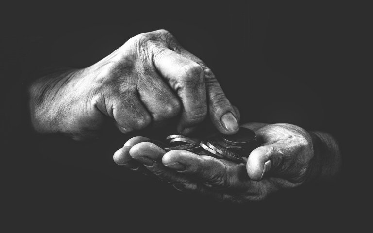 Image of a pair of hands and coins