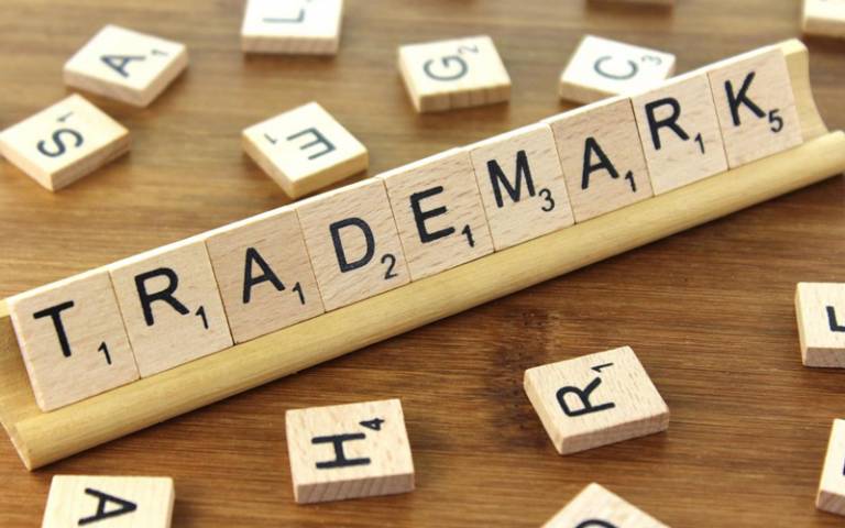 Trademark spelled with scrabble pieces