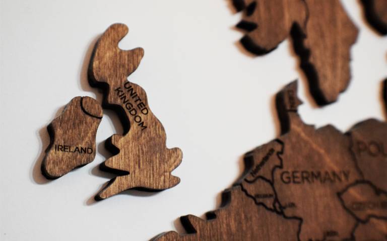 Wood block carving of United Kingdom on teh edge of europe