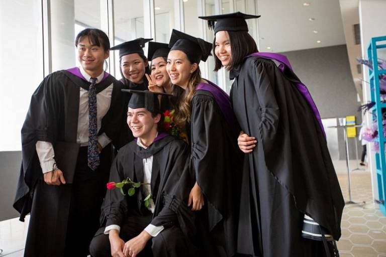 group of students in graduation gowns