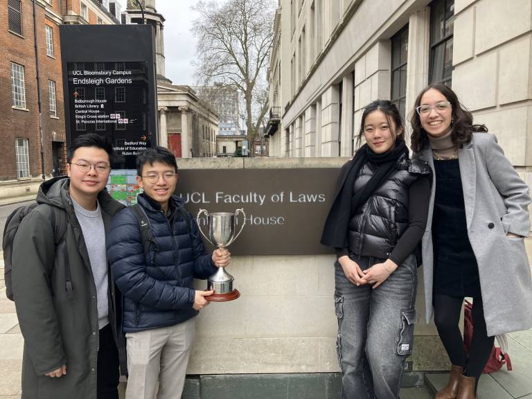 UCL Laws Jessup team standing outside Bentham House with the trophy