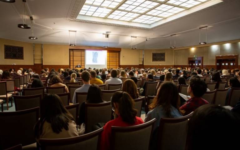 Students sitting in rows listening to a lecture at the 2019 LLM induction