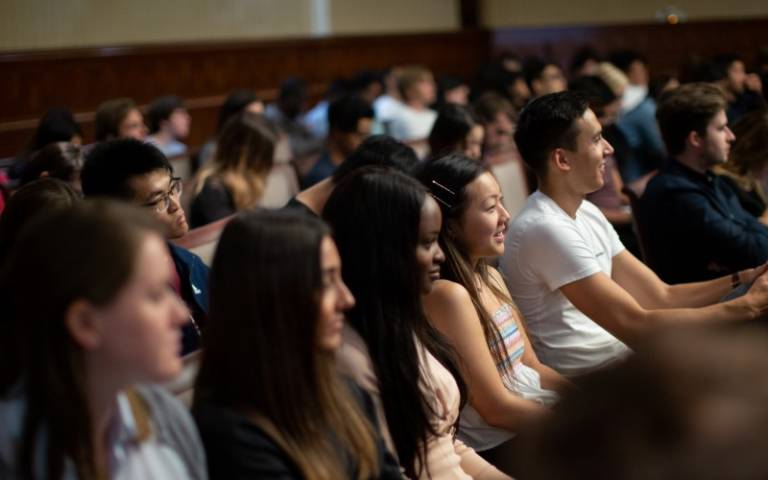 Rows of students sitting in a lecture theatre