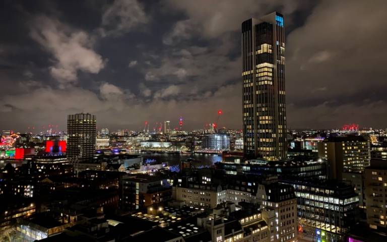 Skyline of London city at night time. The image has skyscrapers and office blocks