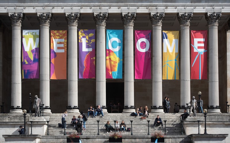 A large welcome sign at the Portico building