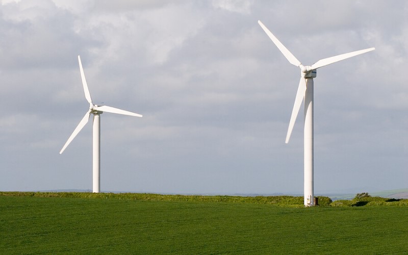 Two wind turbines in a field in North Wales