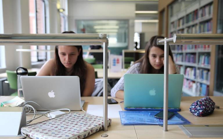 Two students work in the Queen Square Library