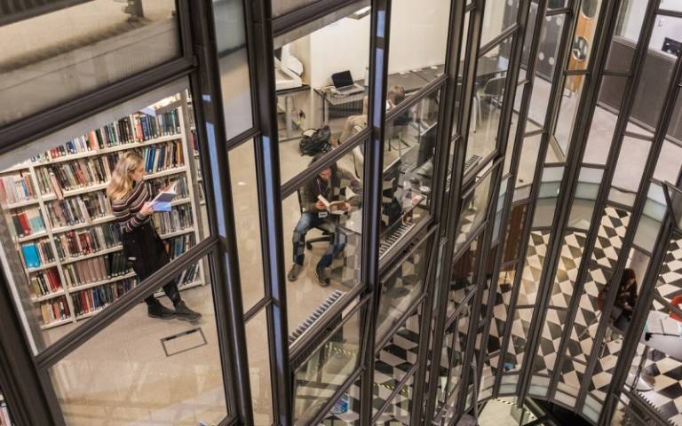 Students working in the SSEES Library, photo taken from above.