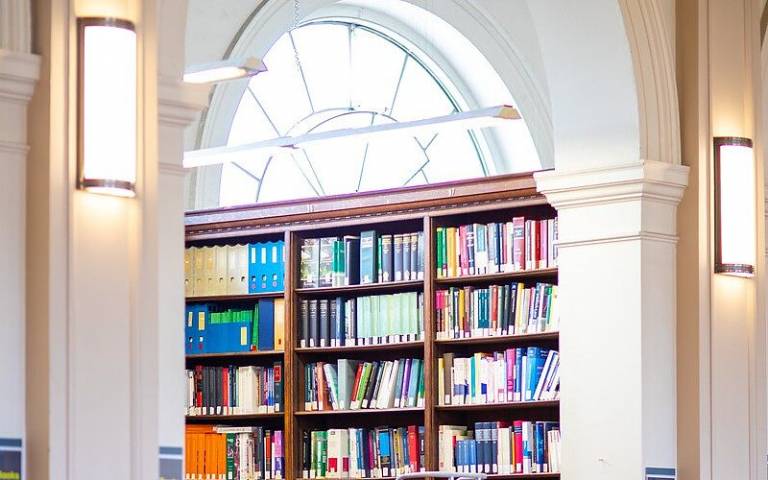 Books on shelves within the Donaldson Reading Room, UCL Main Library