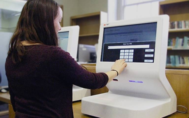 Self-service machine being used by a library user