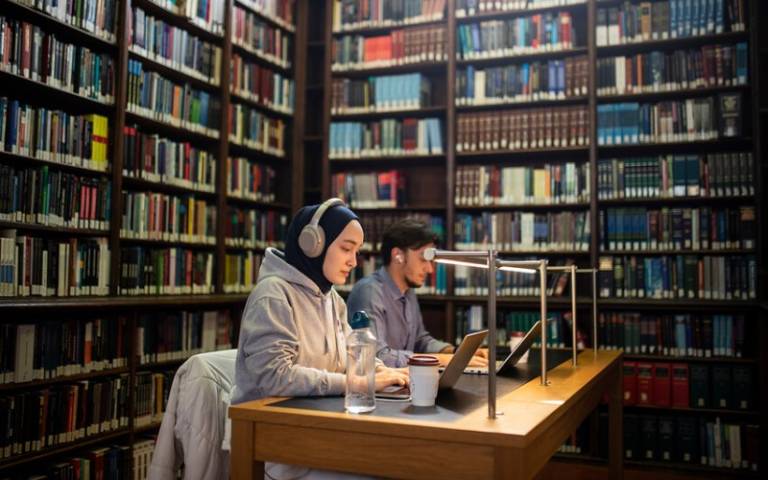 Two students work in the Donaldson Law Library.