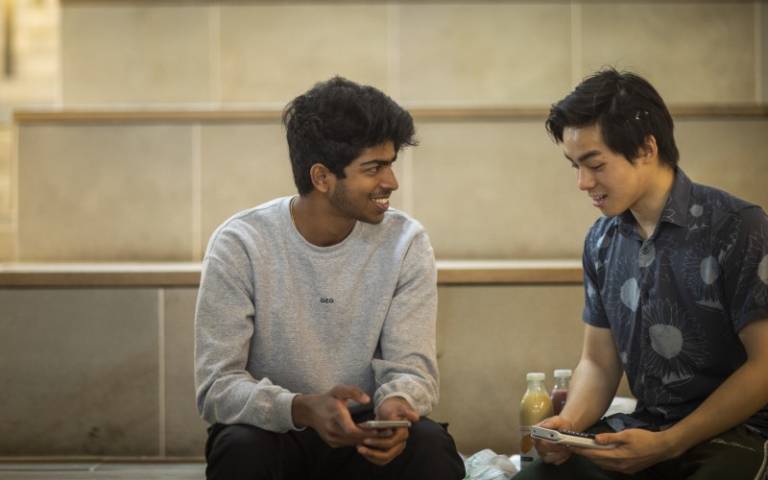 Two students sharing a joke and enjoying a short break in the Student Centre.