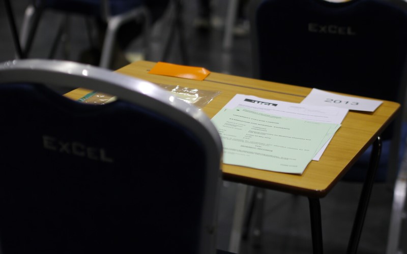 Exam paper on desk in hall