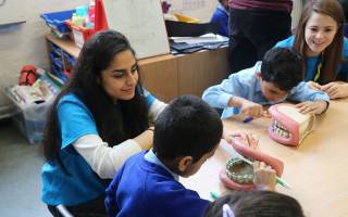 Hania Qureshi volunteering at a Teddy Bear Clinic