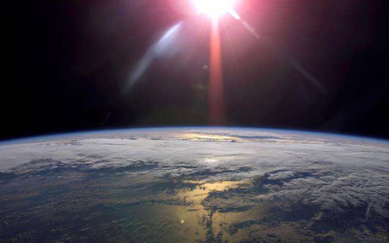 Image of the earth, showing the stratosphere and sun