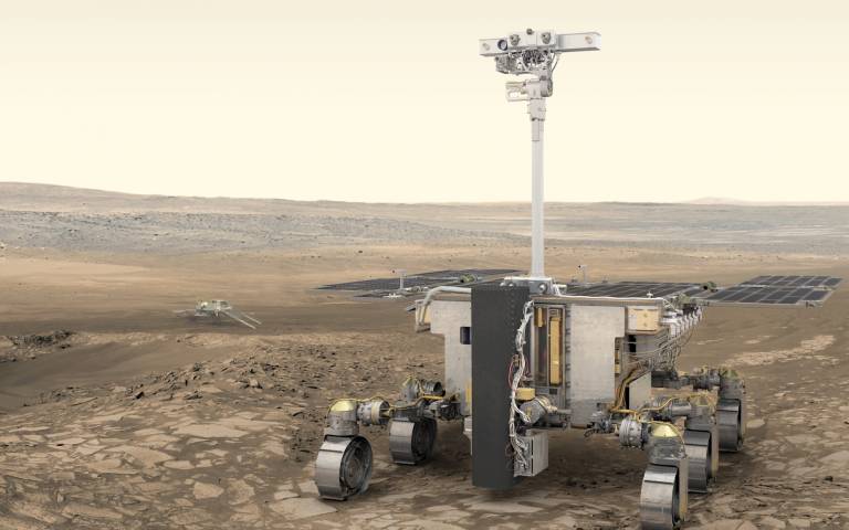 Artist’s impression of ESA’s ExoMars rover (foreground) and Russia’s science platform (background) on Mars. The PanCam, or “eyes” of the rover, is placed at the top of the mast and was developed by a dedicated team of scientists and engineers at the UCL M
