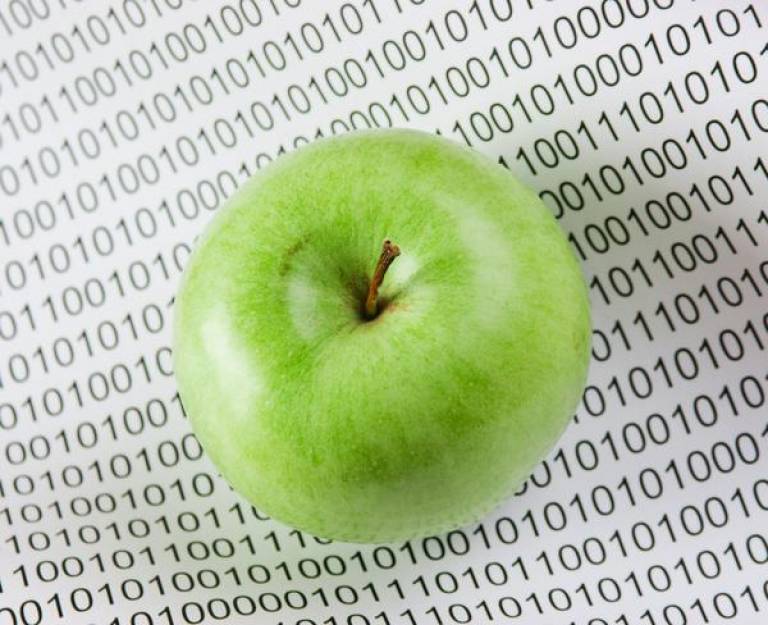 Green apple with binary code