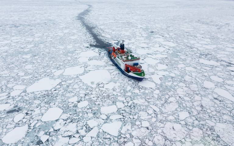 The research ship Polarstern moving through sea ice in the Arctic