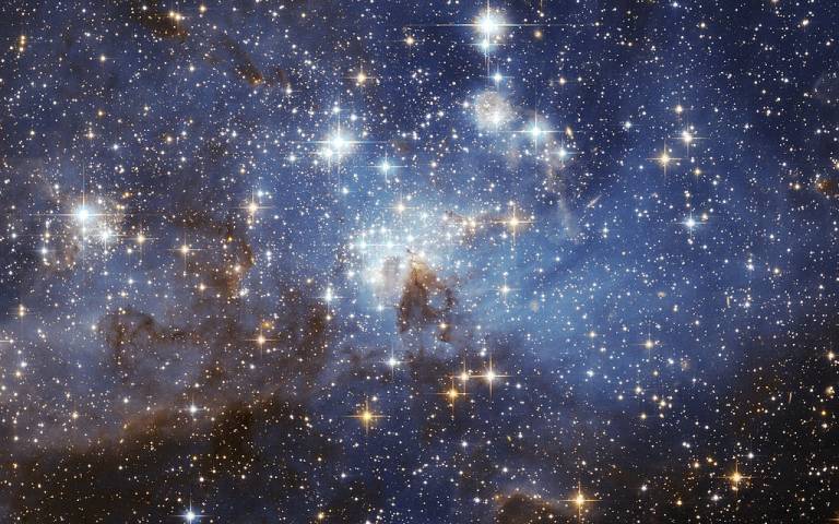A European Space Agency image, taken using the Hubble Space Telescope, featuring the LH 95 star forming region of the Large Magellanic Cloud.