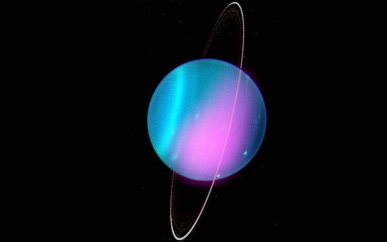 A Chandra X-ray image of Uranus from 2002 (in pink) superimposed on an optical image from the Keck-I Telescope obtained in a separate study in 2004. Credit: X-ray: NASA/CXO/UCL/W. Dunn et al; Optical: W.M. Keck Observatory