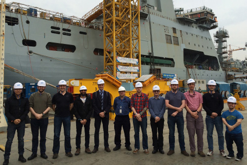 Naval Architects in front of a ship