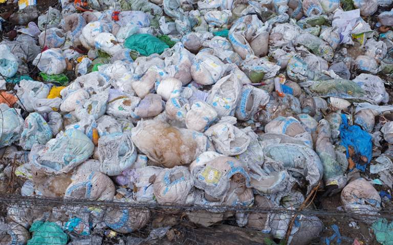photo of a mound of used nappies dumped
