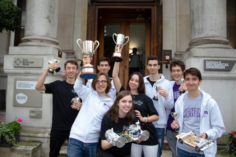 UCL MechEng students holding their trophies aloft for the IMechE Design Challenge 