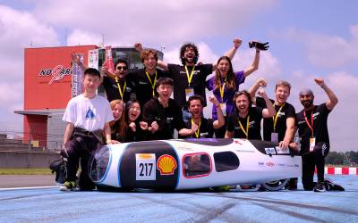 UCL Eco-Marathon team pose with their vehicle in Nogaro France