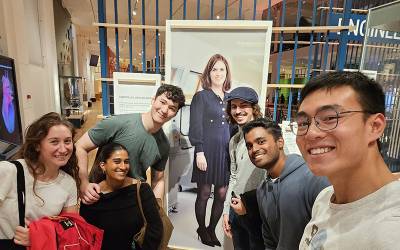 Students pose with portrait of Professor Rebecca Shipley