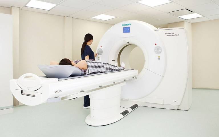 Patient and clinician using CT scanner