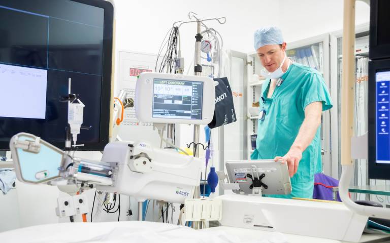 man standing in operating theatre 