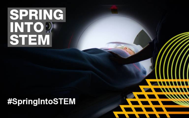 a picture of a patient on an MRI scanner bed with the Spring into STEM branding