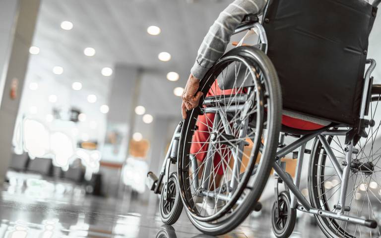 an elderly person sitting in a wheelchair 