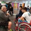 students talking to users of wheelchairs