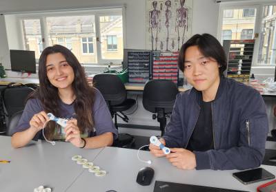 Two students sitting in the lab
