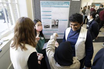 Students participating at the undergraduate poster event, smiling faces
